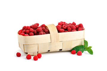 Tasty ripe raspberries in the basket on white background.
