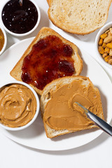 toast with peanut butter and jam for breakfast, vertical top view