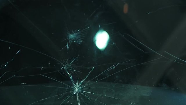 Breaking the car glass with a hammer