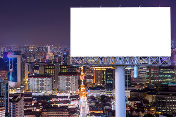 Blank billboard for advertisement in city downtown at night