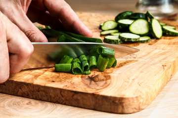 slicing vegetables with a knife for cooking