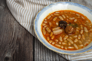 Stew of beans with chorizo and pork