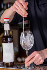 Bartender prepares a cocktail