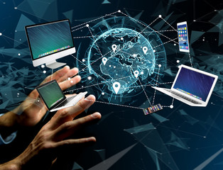 Computer and devices displayed on a futuristic interface with interantional network - Multimedia and technology concept