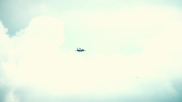 Modern Russian fighter performing landing descent. Slow motion shot