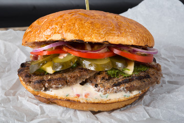 Huge burger on a wrapping paper
