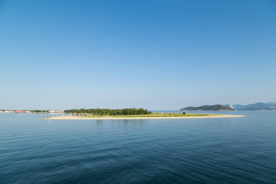 View from the sea to the beach of Keramoti, Greece