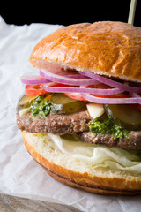 Huge burger on a wrapping paper