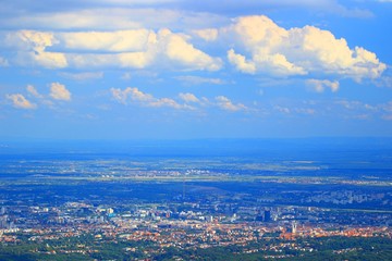 Zagreb, capital of Croatia, panoramic view form Medvednica mountain, cumulus clouds on blue sky