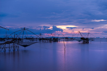 Fototapeta premium traditional local fisherman used net fishing in Pakpra Thale Noi, one of the country's largest wetlands covering Phatthalung, Nakhon Si Thammarat and Songkhla ,South of THAILAND.
