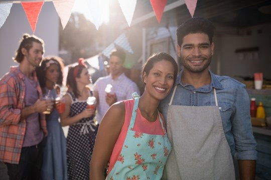 Portrait of happy waiter and waitress