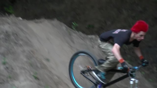 Dirt riding on modern bike in the forest slow motion