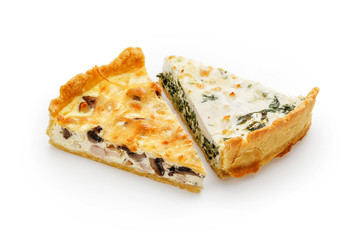 Two slices of spinach and chicken pies isolated on white