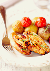 Chicken Breast with Baked Potatoes and Cherry Tomatoes