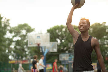 African american man plays on basketball court. Real and authentic activity.
