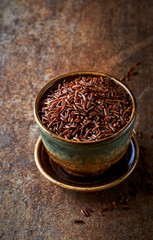 Organic red Rice in a Ceramic Cup