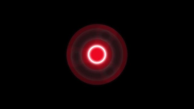 Glowing rotating trend fidget hand spinner on black background