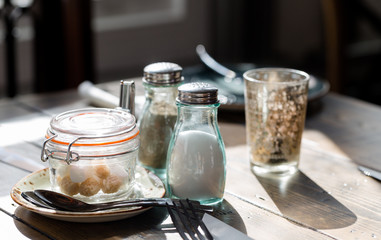 Breakfast table service on rustic, shabby chic style, table in morning sun light