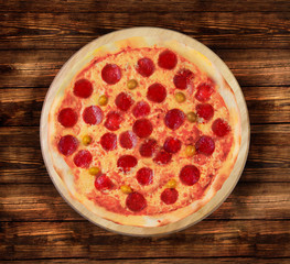 Pizza pepperoni on the  wooden table. This picture is perfect  to design your restaurant menus. Visit my page. You will be able to find an image for every pizza sold in your cafe or restaurant.   
