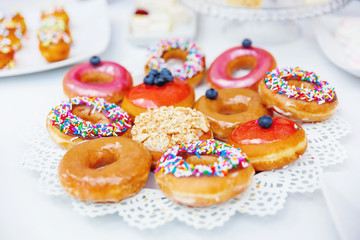 Candy bar on wedding ceremony. Decorated table with sweets for the guests of the ceremony.