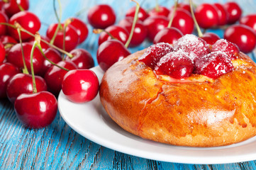 Bun with red cherry