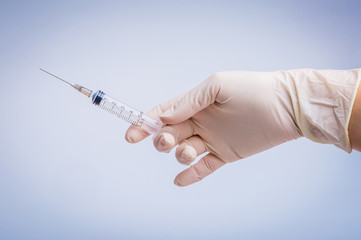 Health nurse worker with vaccine syringe