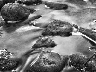 Boulders and rocks in a stream, black and white - 163010994