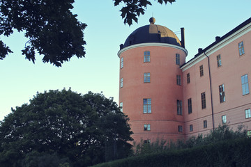 Beautiful summer season specific photograph. An old castle in Uppsala, Sweden. Great colors and beautiful blue sky. - 163012720