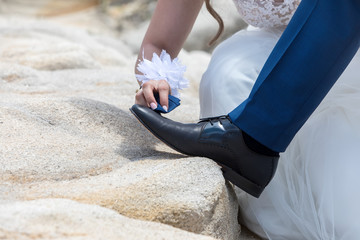 feet of bride and groom, wedding shoes