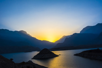 Sunset on Wadi Dayqah Dam - obrazy, fototapety, plakaty