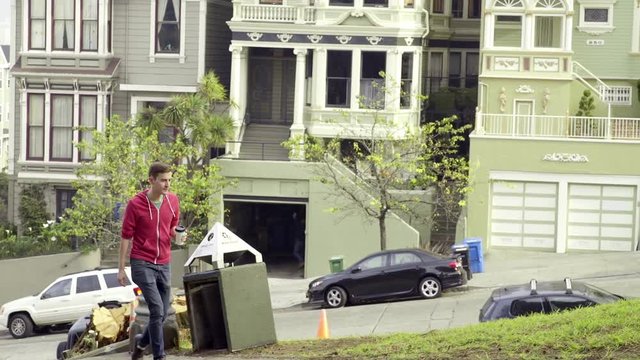 Man Takes A Walk Through Alamo Square, Stops And Takes A Photo Of The Painted Ladies