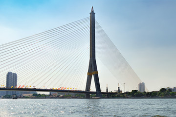 Obraz premium The Rama VIII bridge over the Chao Phraya river in Bangkok, Thailand.