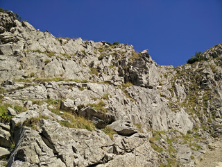 Rocky wall on the patch to the Giewont in Tatra Mountains in Poland with a blue sky