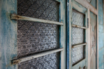 Vintage patterned glass in old door