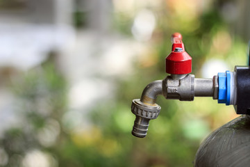 faucet water, pressure gauge, water filters with soft-focus and over light in the background