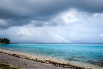 Rainbow on Temae Beach lagoon in Moorea island