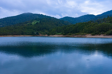 Fototapeta na wymiar Calm water of mountain lake
