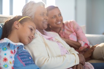 Happy family relaxing on sofa in living room
