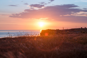 Sunset over the cliff and sea view