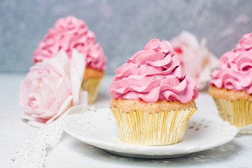Pink Wedding cake with roses and macaroons. Holiday celebration concept. Top view, flat lay