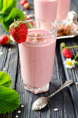 Strawberry smoothie on a wooden table
