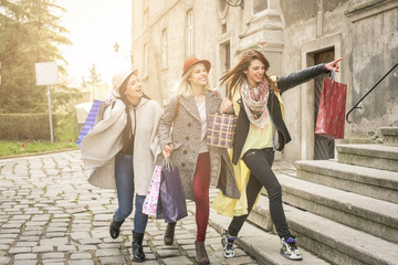 Fototapeta premium Three best friends running on the street .