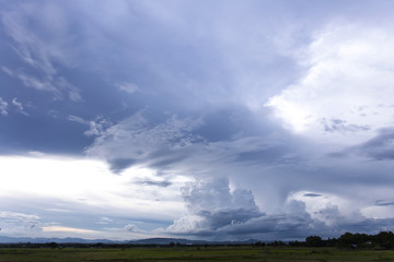 Grey solid cloud is rain over the farm
