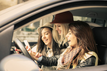 Three best friends riding in the car.
