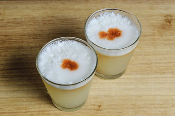 two glasses of cocktail pisco  sour