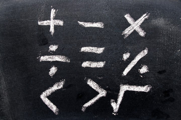 Set of math symbol draw by chalk on black board background