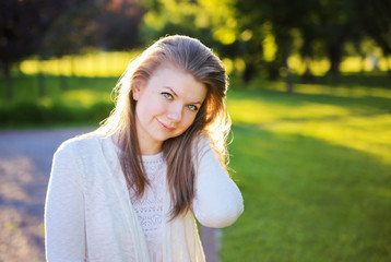 Beautiful young woman in the park. Portrait