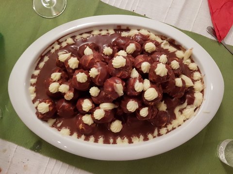 Profiterole, cream puff, or choux &agrave; la cr&egrave;me is a filled French choux pastry ball with a typically sweet and moist filling of whipped cream, custard, pastry cream, or ice cream