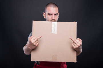 Angry mover man holding box showing double obscene gesture
