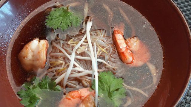 soup with seafood and soy sprouts in the restaurant